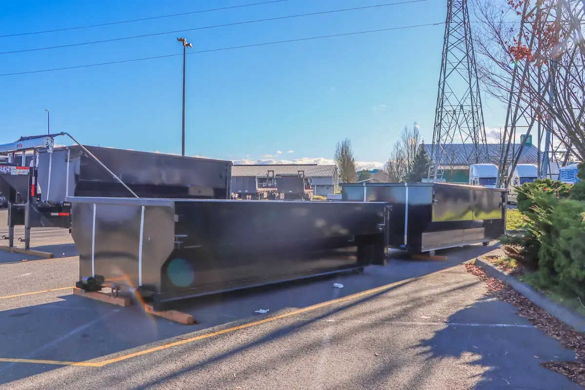 Roll-off dumpster ready for waste disposal at job site for Demolition Dumpster Rental in Marquette